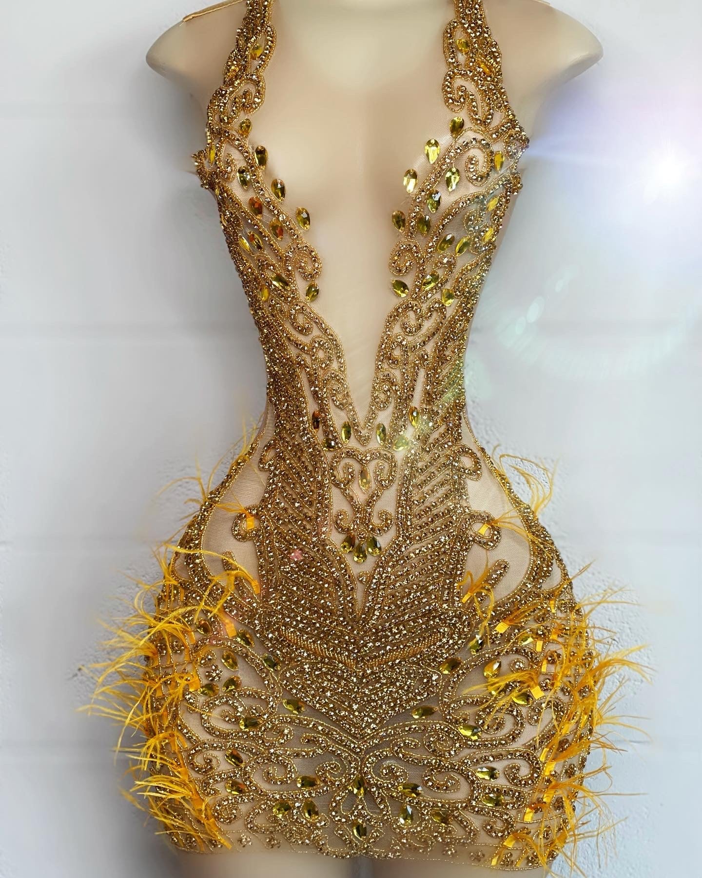 Jayla (gold w/ feathers)